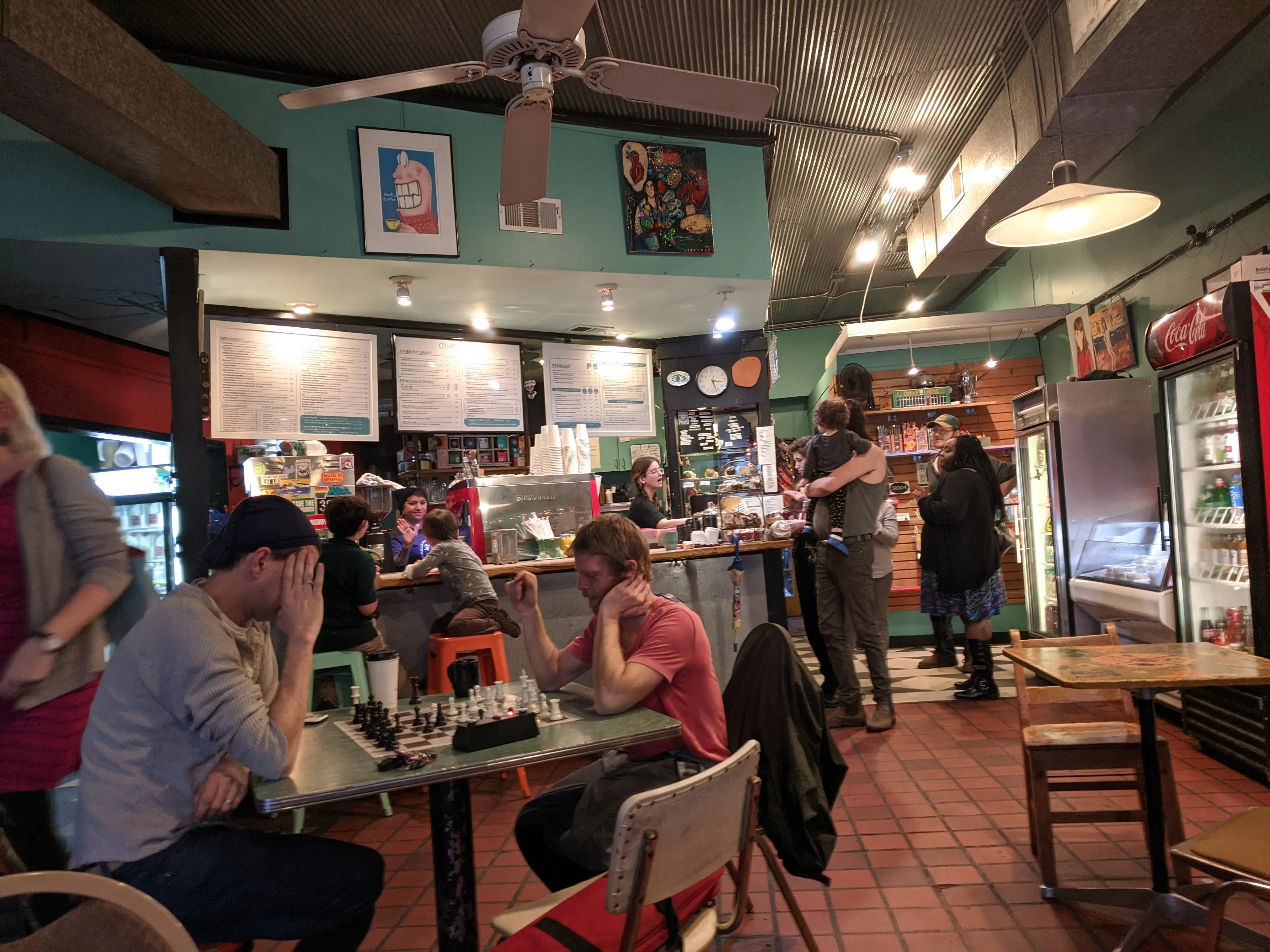 Private event guests socializing inside Otherlands Coffee Bar in Memphis