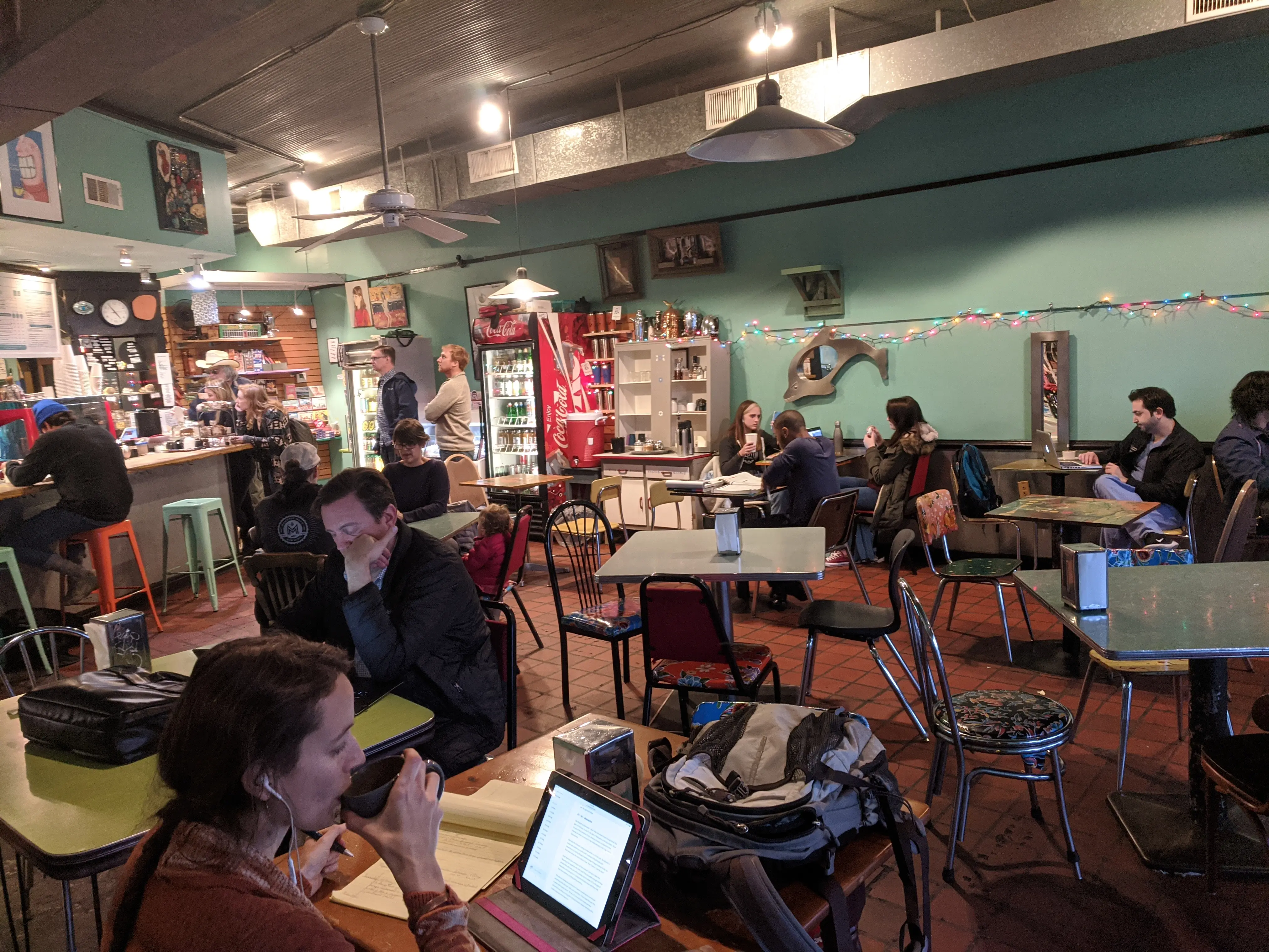 Private event guests socializing inside Otherlands Coffee Bar in Memphis