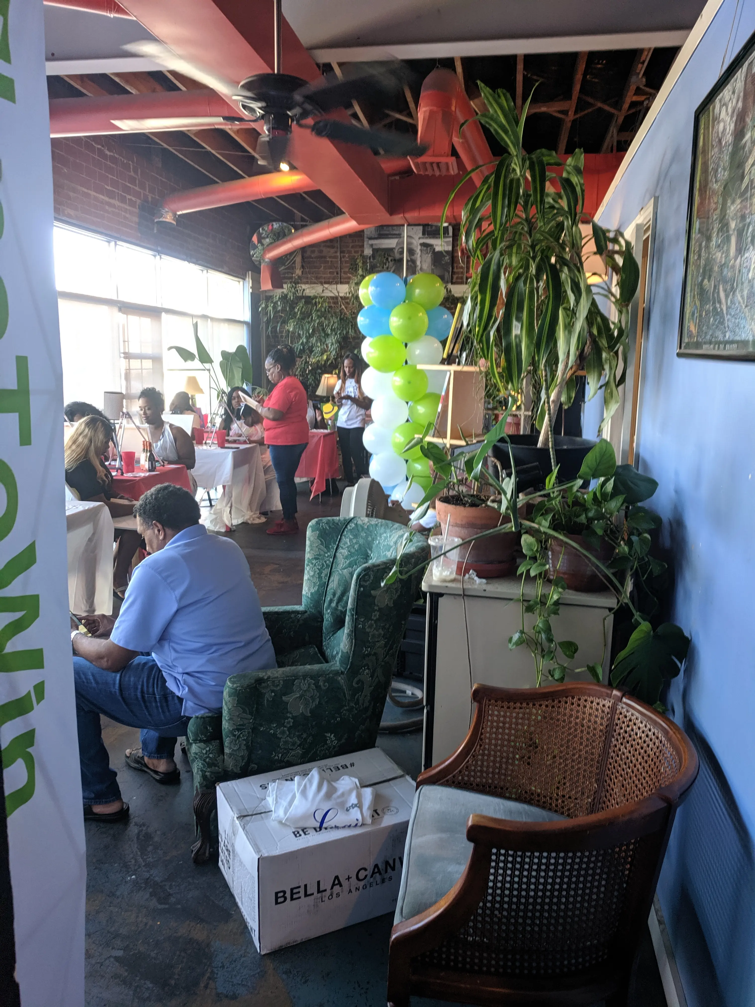 Private event guests socializing inside Otherlands Coffee Bar in Memphis