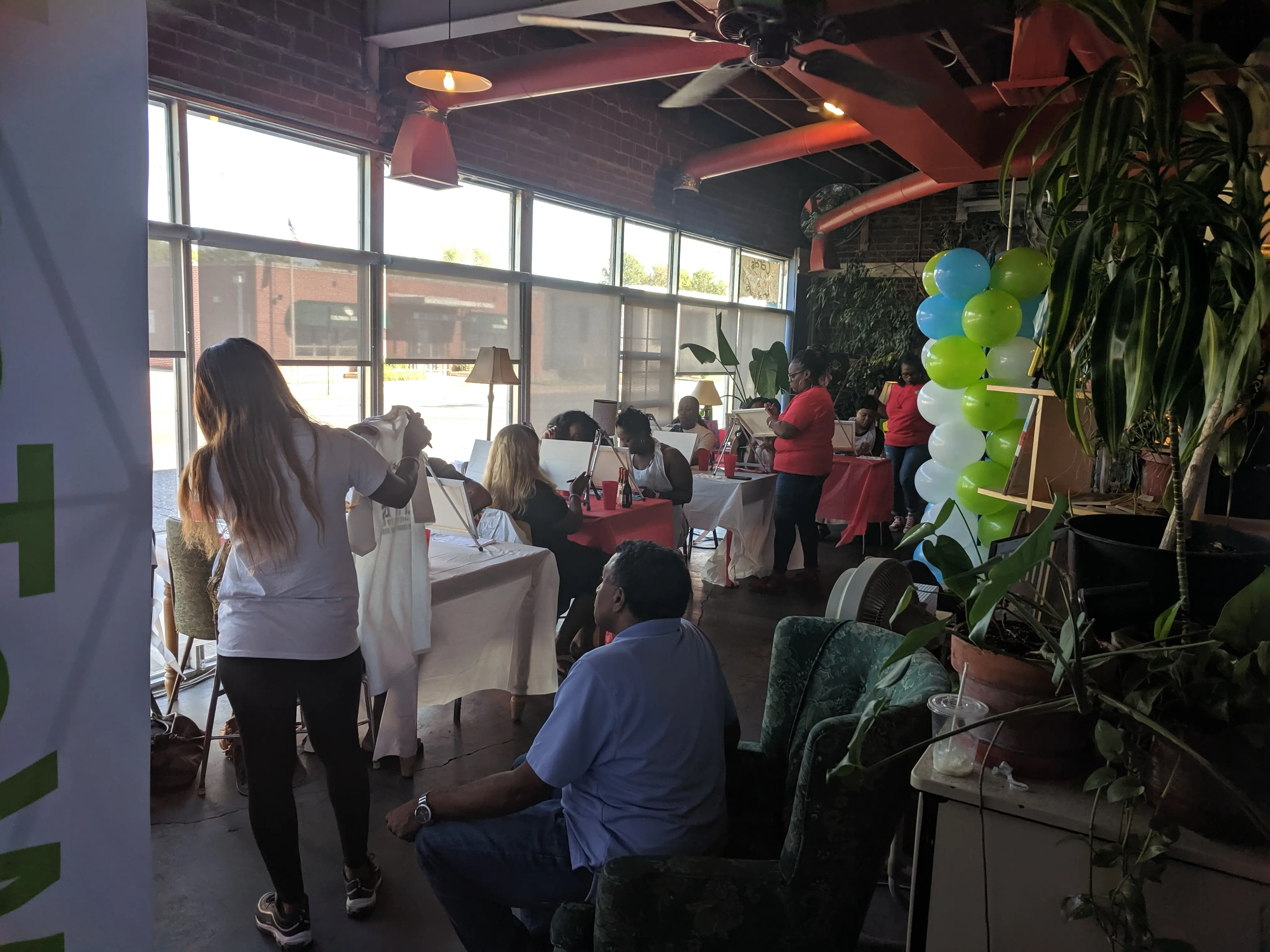 Private event guests socializing inside Otherlands Coffee Bar in Memphis
