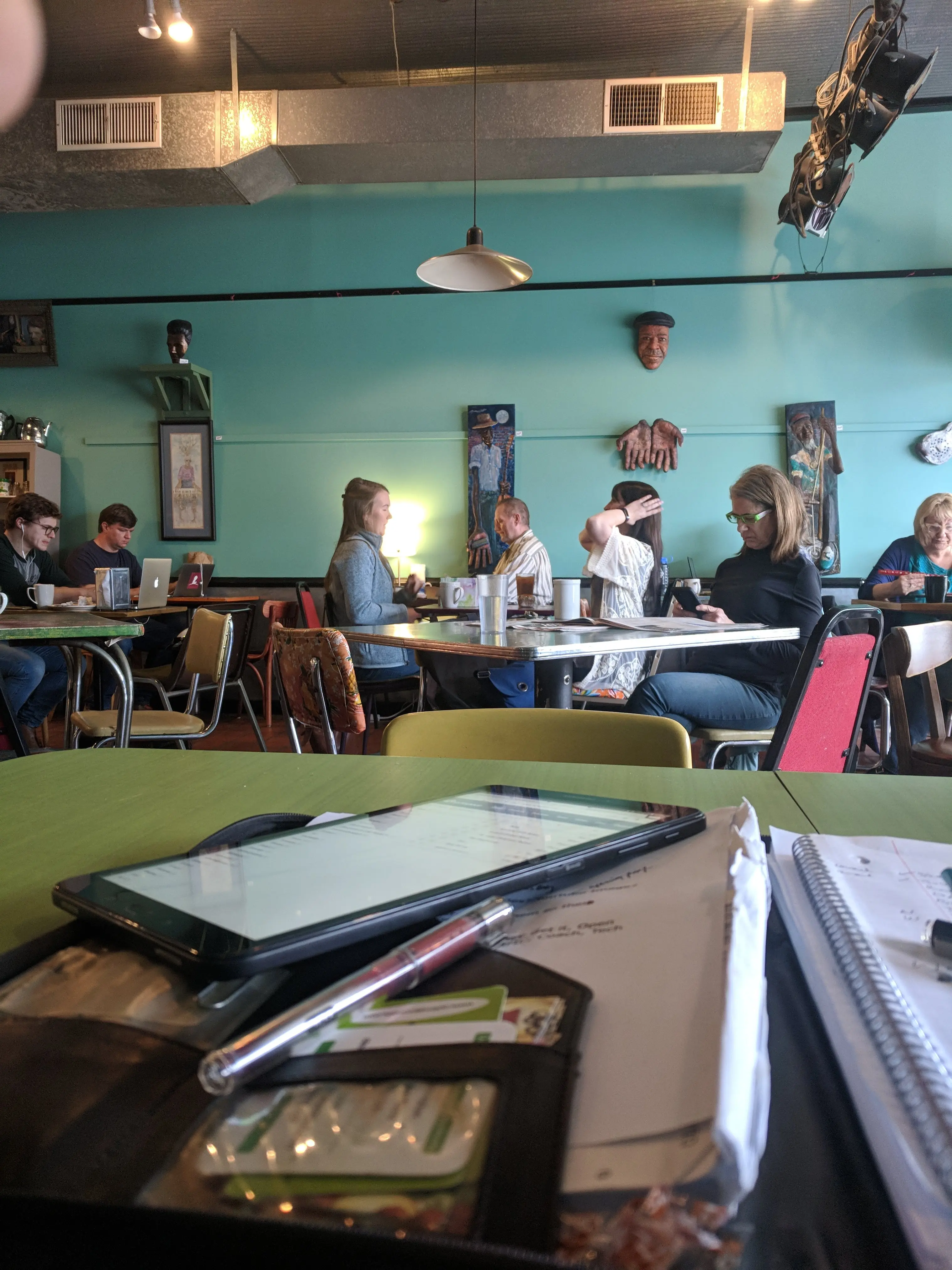 Private event guests socializing inside Otherlands Coffee Bar in Memphis